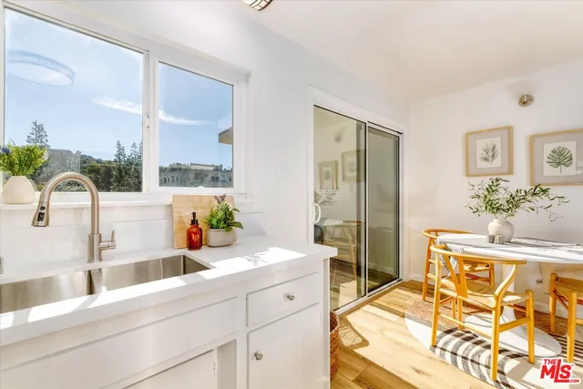 a spacious bathroom with a double vanity sink and a bathtub