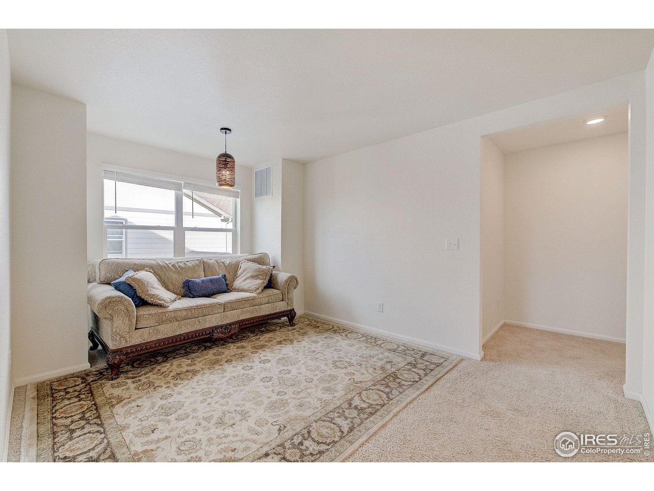 327 Central Avenue Severance, CO 80550 - Photo 14 of 40 a living room with furniture and a window