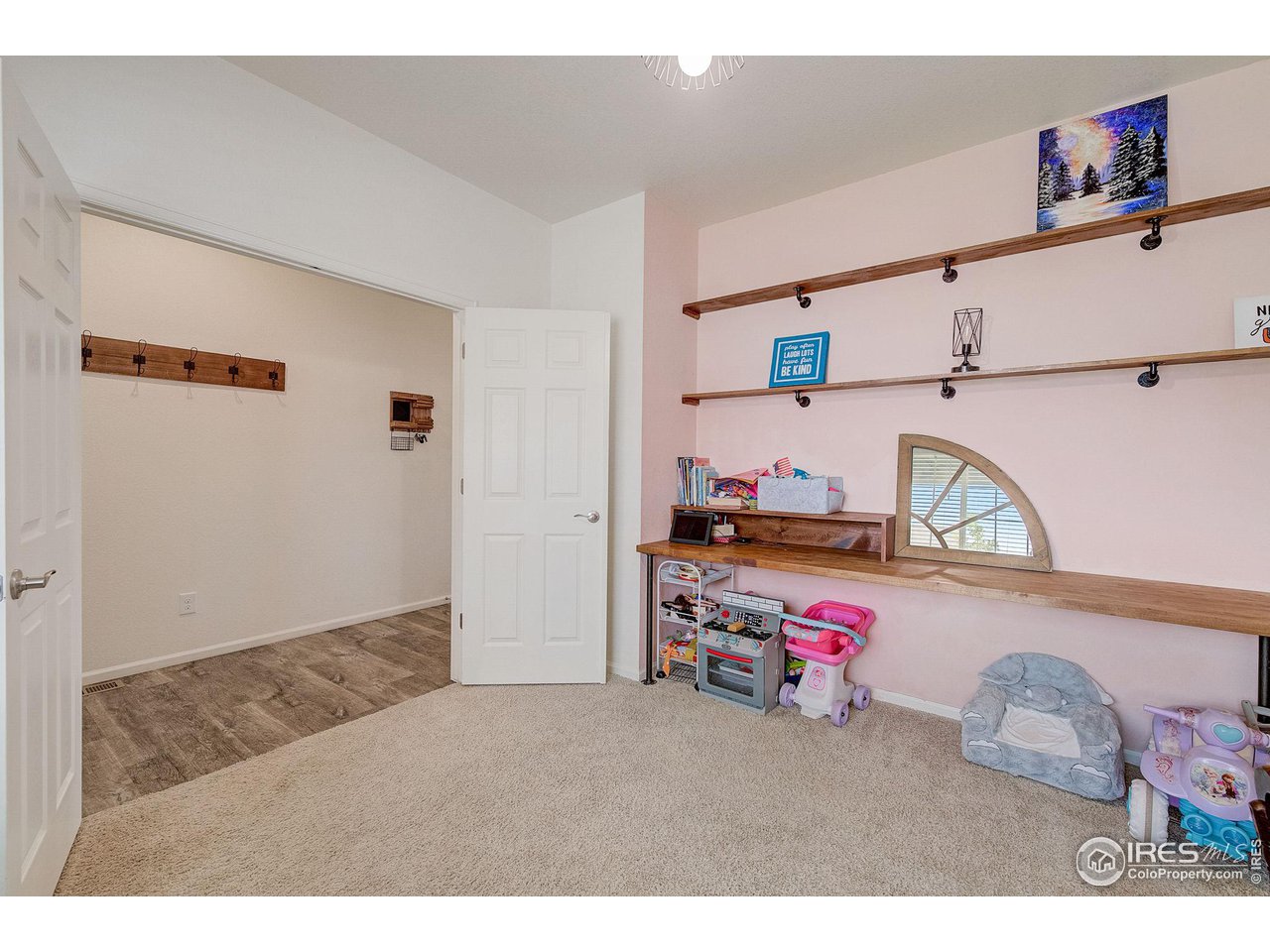 327 Central Avenue Severance, CO 80550 - Photo 20 of 40 a bedroom with a bed and cabinets