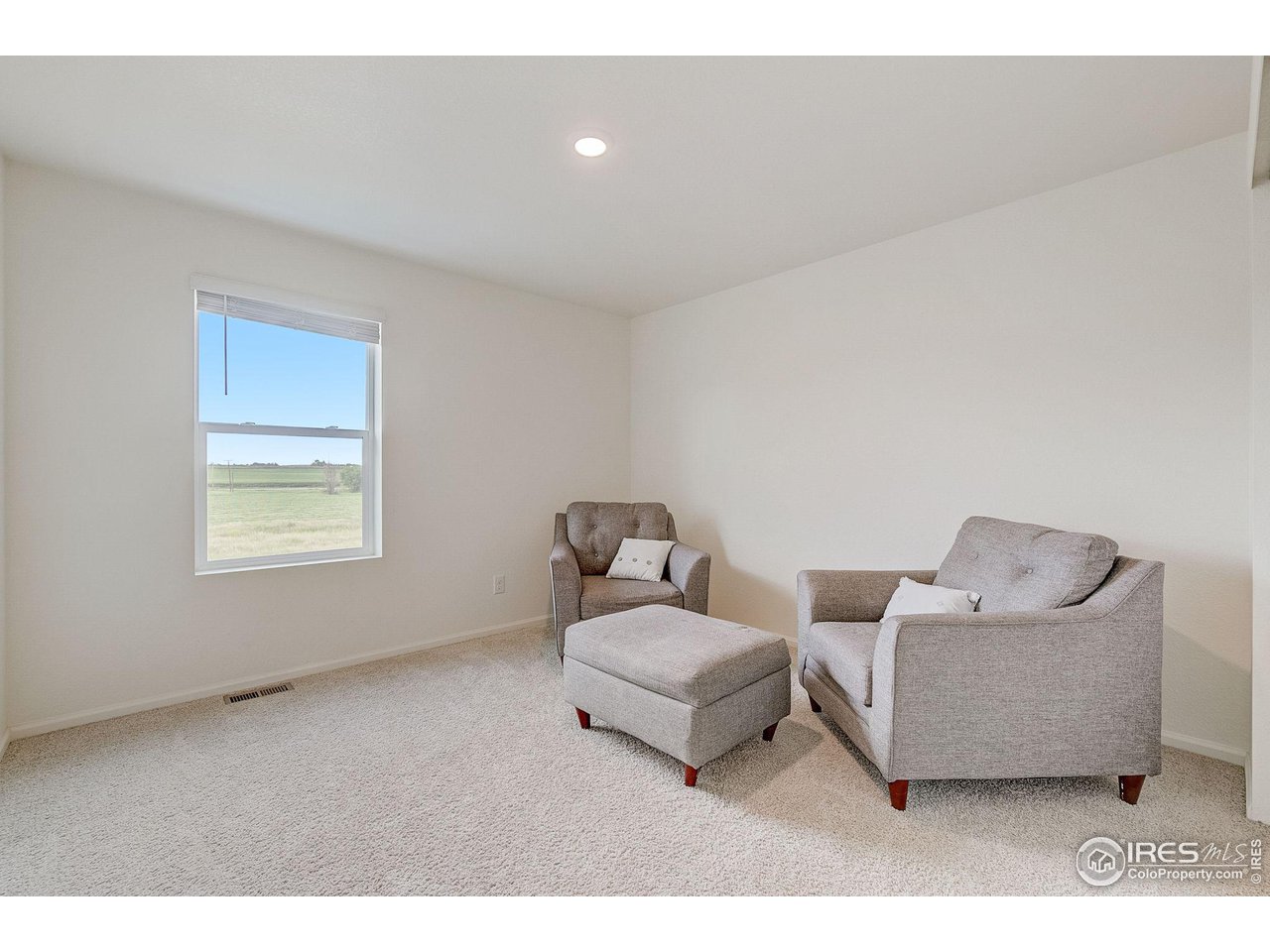 327 Central Avenue Severance, CO 80550 - Photo 25 of 40 a living room with furniture and a window
