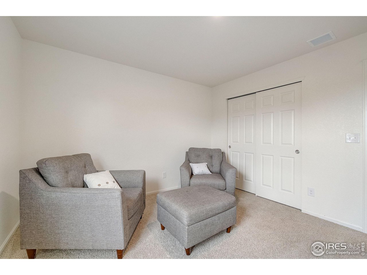 327 Central Avenue Severance, CO 80550 - Photo 26 of 40 a living room with furniture and a couch