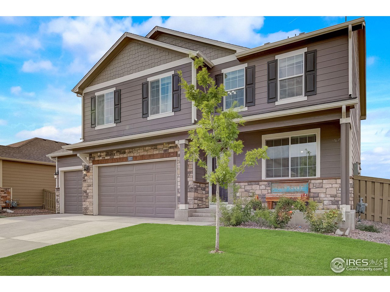 327 Central Avenue Severance, CO 80550 - Photo 3 of 40 a front view of a house with garden