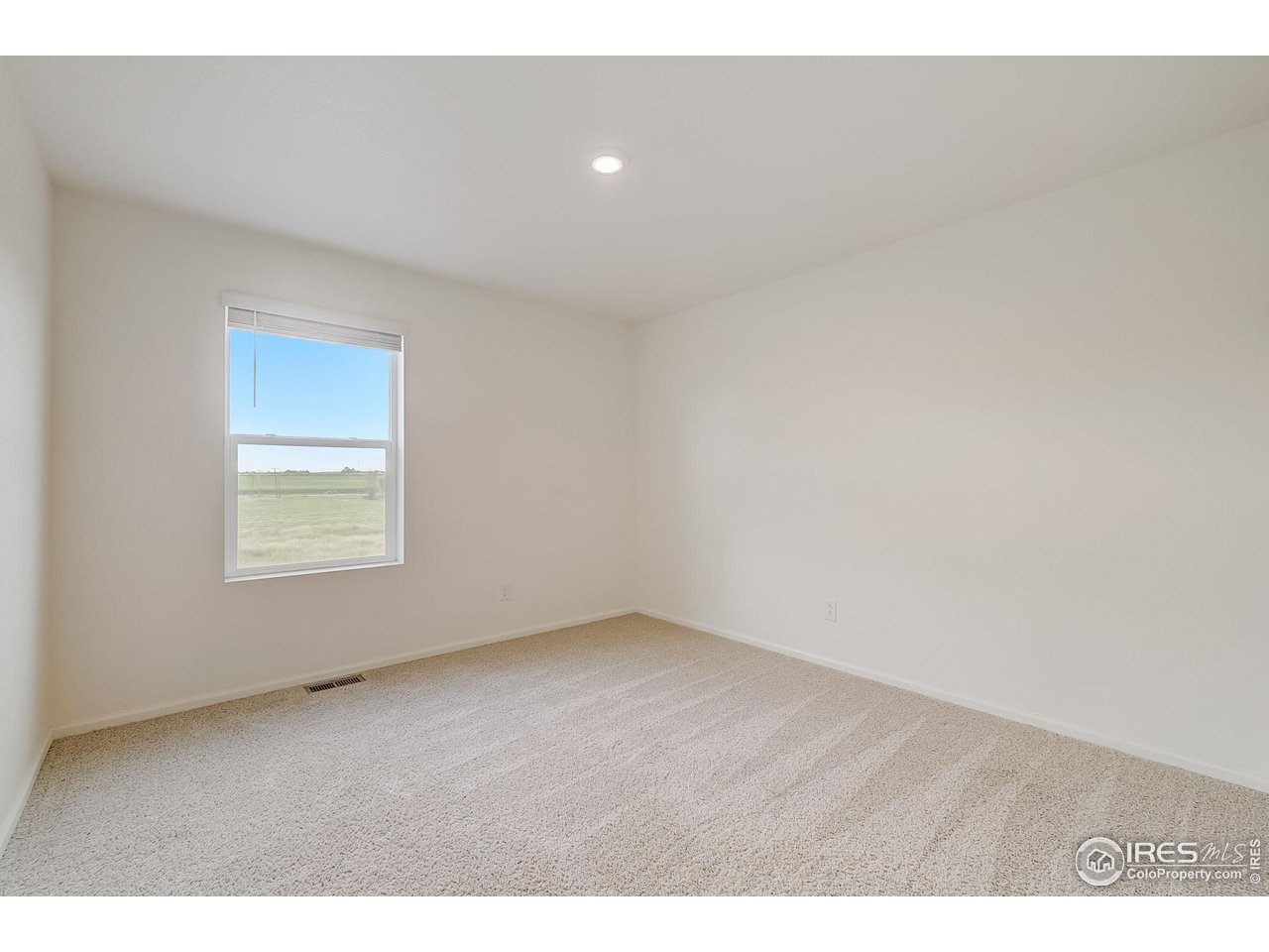 327 Central Avenue Severance, CO 80550 - Photo 31 of 40 a view of an empty room with a window