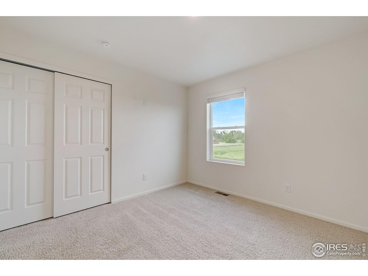 327 Central Avenue Severance, CO 80550 - Photo 32 of 40 a view of an empty room with a window