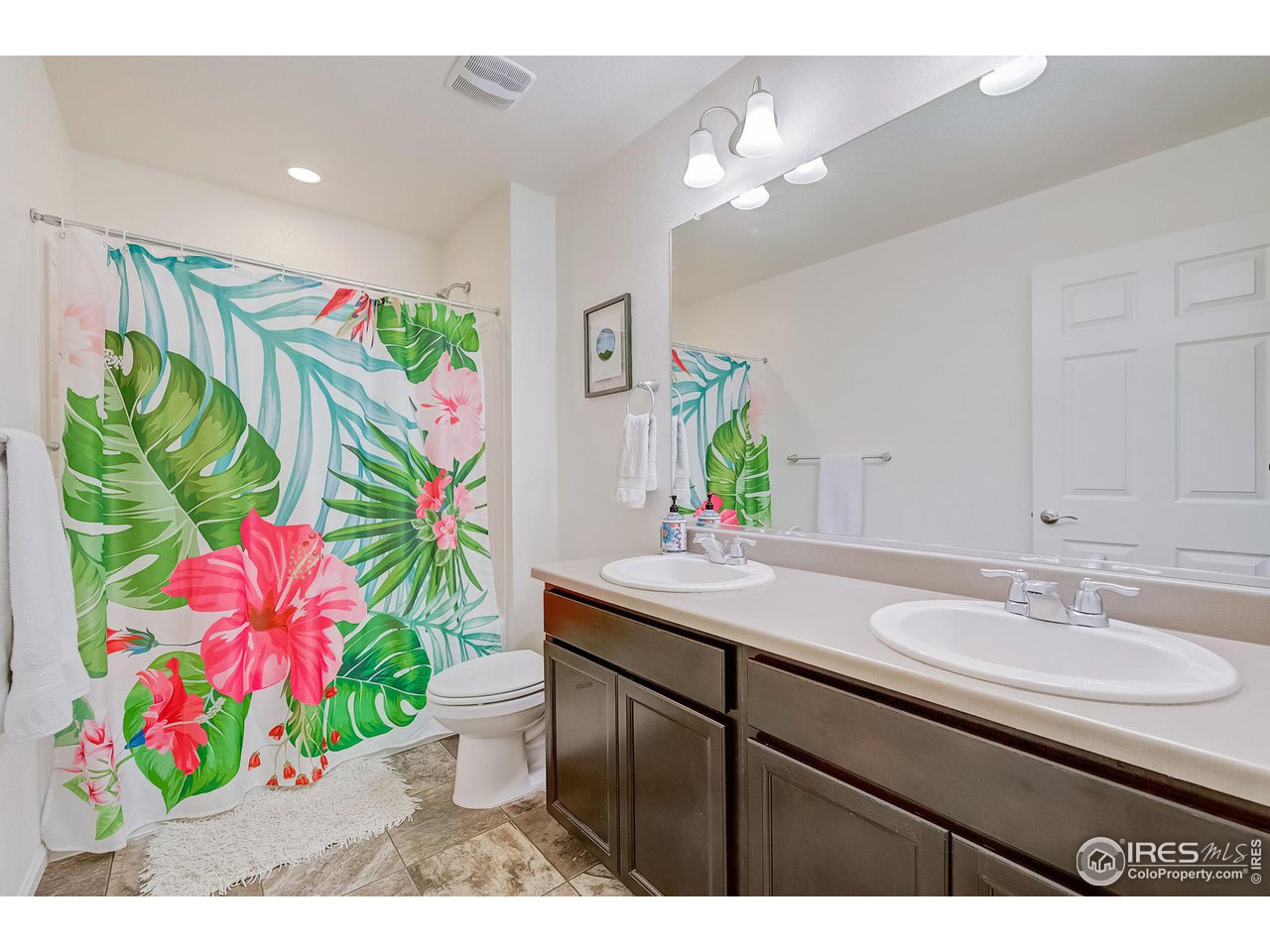 327 Central Avenue Severance, CO 80550 - Photo 34 of 40 a bathroom with a sink mirror and vanity