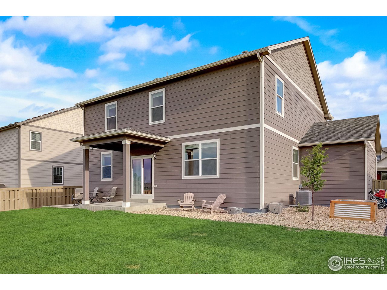 327 Central Avenue Severance, CO 80550 - Photo 37 of 40 a front view of a house with a yard