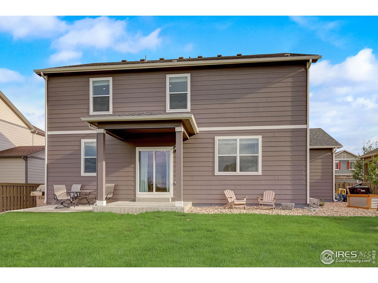 327 Central Avenue Severance, CO 80550 - Photo 40 of 40 a brick house with a small yard