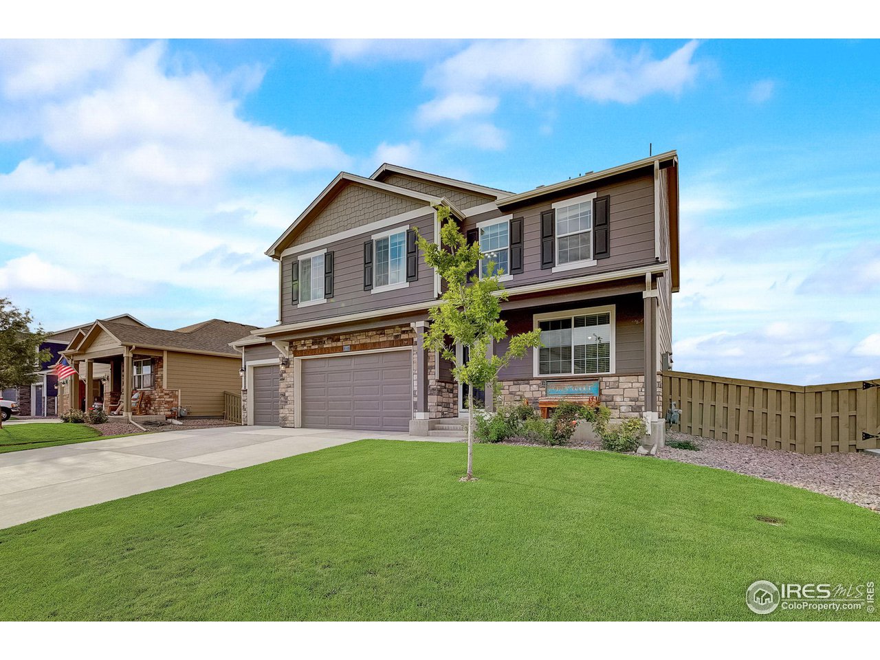 327 Central Avenue Severance, CO 80550 - Photo 4 of 40 a view of a yard in front of a house
