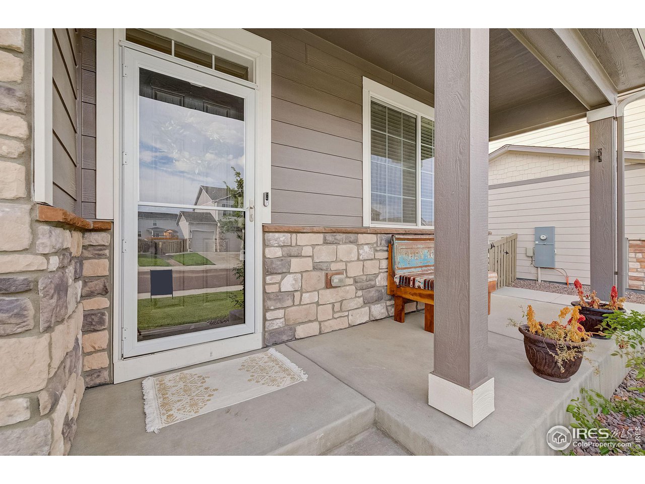 327 Central Avenue Severance, CO 80550 - Photo 8 of 40 a backyard of a house with outdoor seating