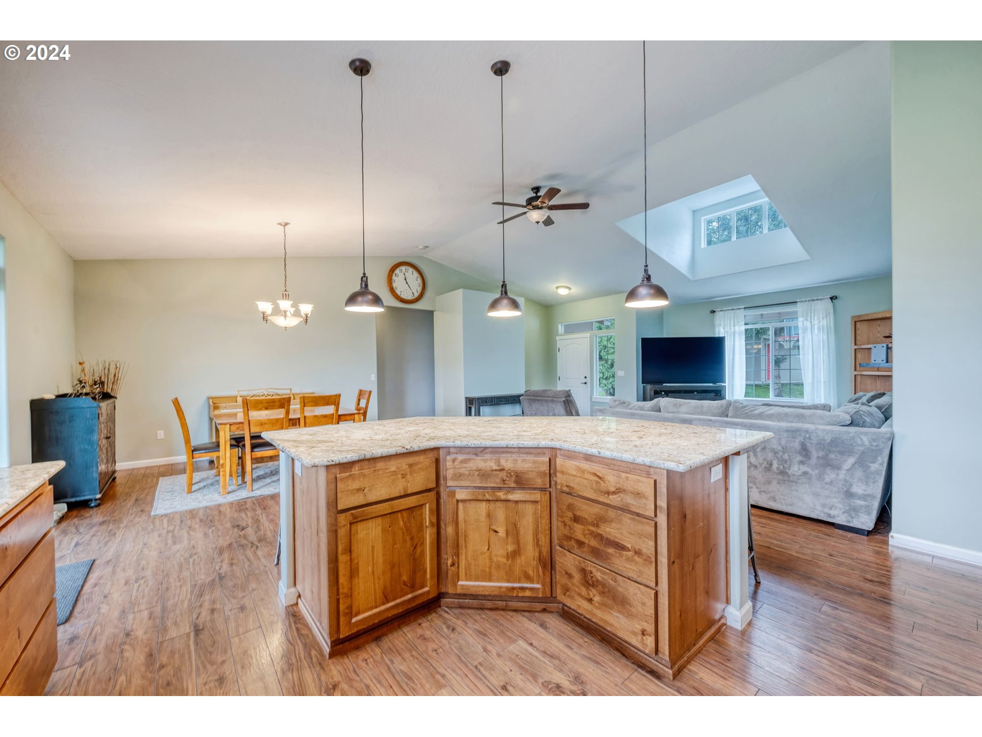 1032 Weaver Road Myrtle Creek, OR 97457 - Photo 12 of 42 a open kitchen with a sink and dishwasher with wooden floor