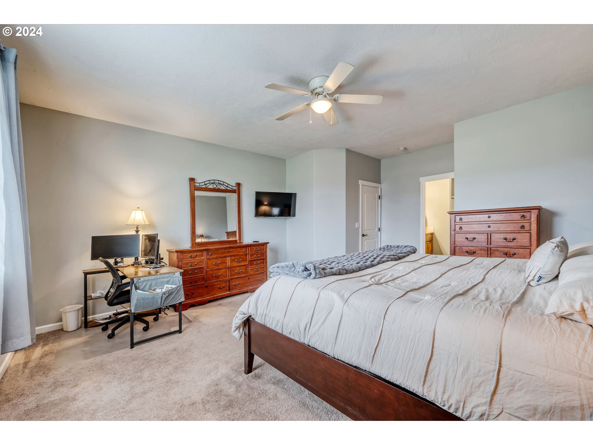 1032 Weaver Road Myrtle Creek, OR 97457 - Photo 14 of 42 a bedroom with a bed and a chandelier
