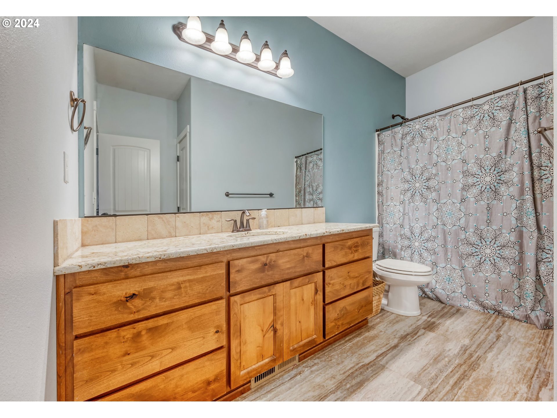 1032 Weaver Road Myrtle Creek, OR 97457 - Photo 20 of 42 a bathroom with a double vanity sink toilet and a mirror