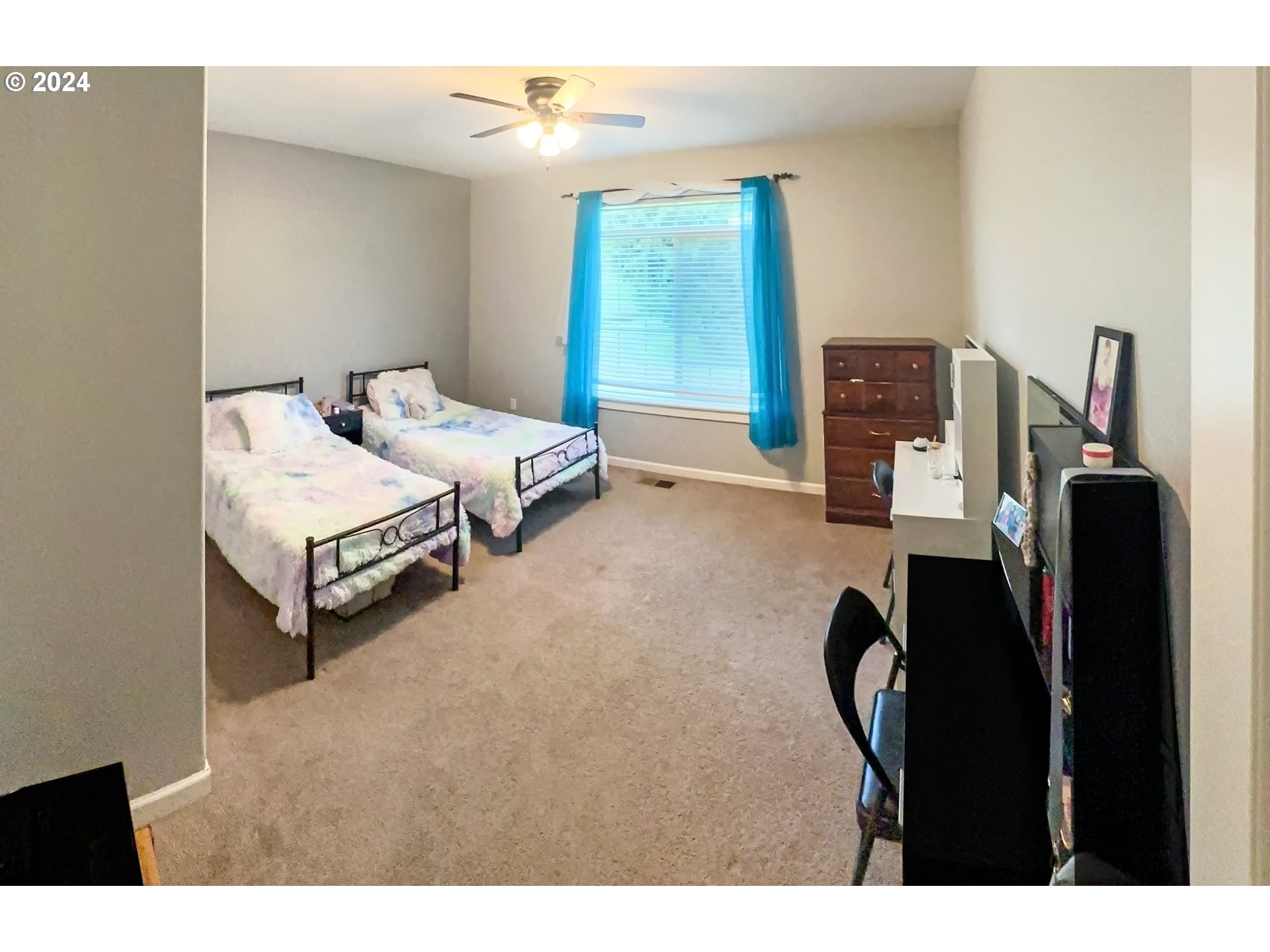 1032 Weaver Road Myrtle Creek, OR 97457 - Photo 22 of 42 a bedroom with furniture and a large window