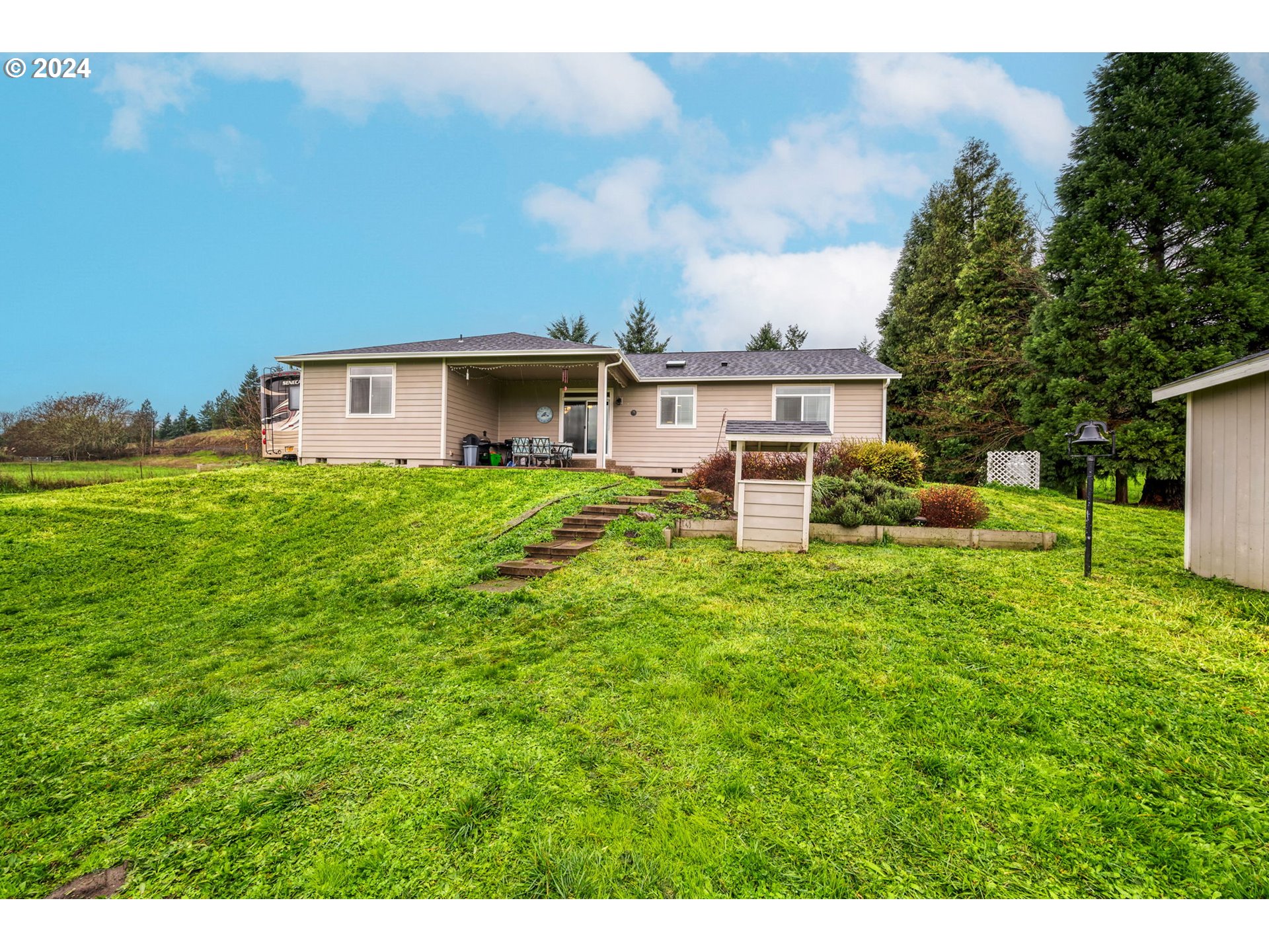 1032 Weaver Road Myrtle Creek, OR 97457 - Photo 28 of 42 a view of a house with a backyard