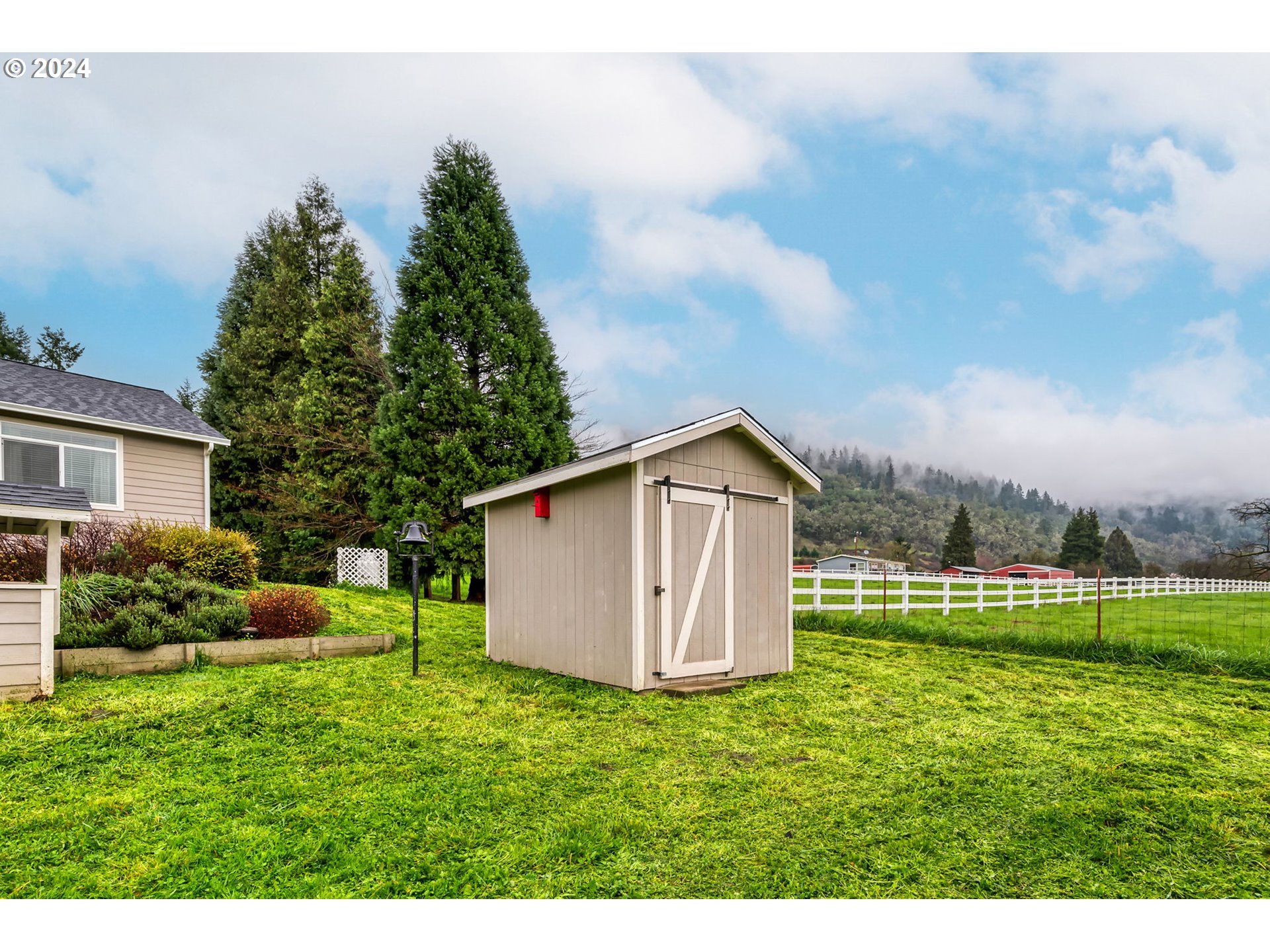 1032 Weaver Road Myrtle Creek, OR 97457 - Photo 36 of 42 a view of an house with backyard space and garden