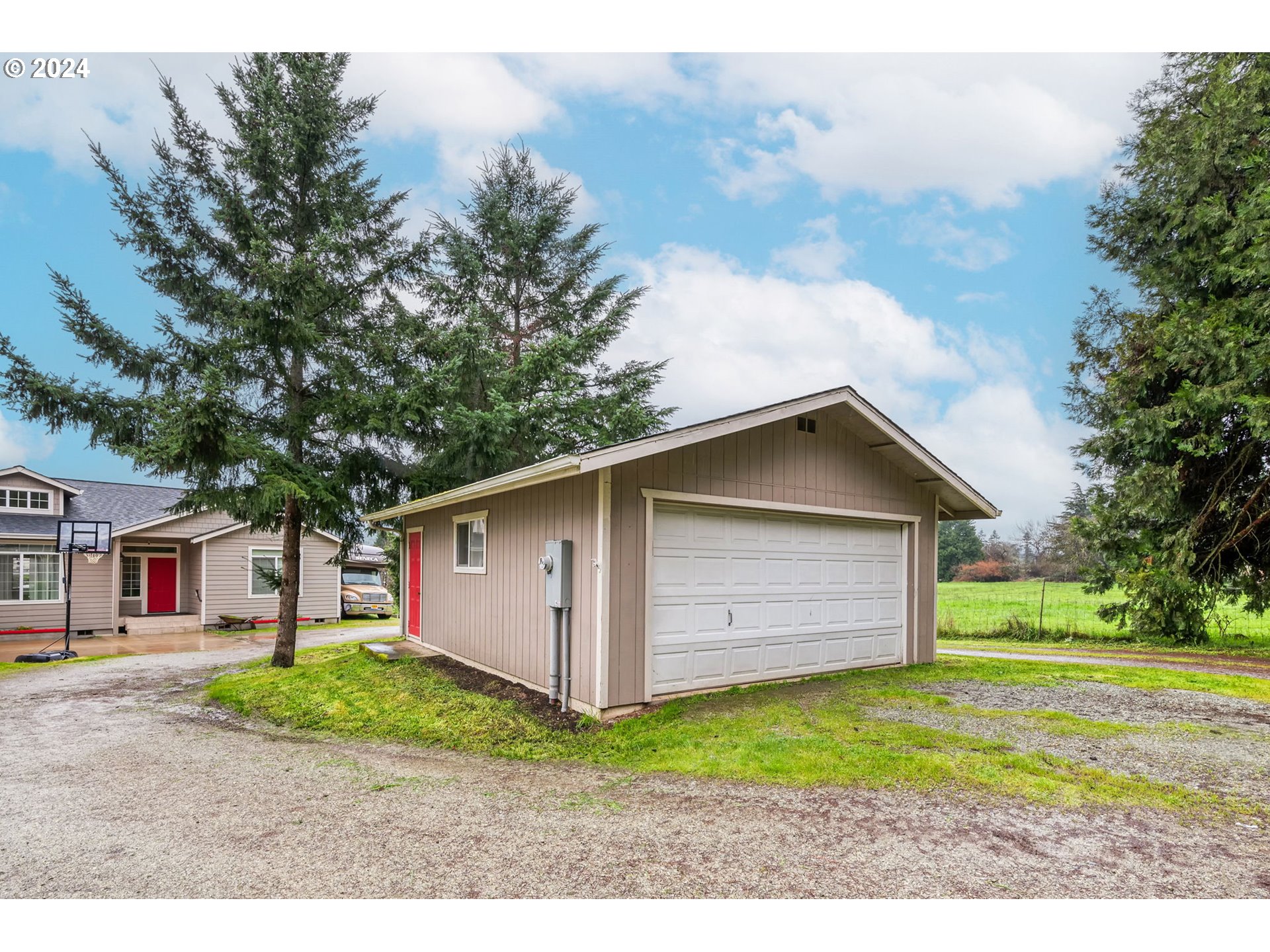 1032 Weaver Road Myrtle Creek, OR 97457 - Photo 37 of 42 a view of a house with a yard and garage