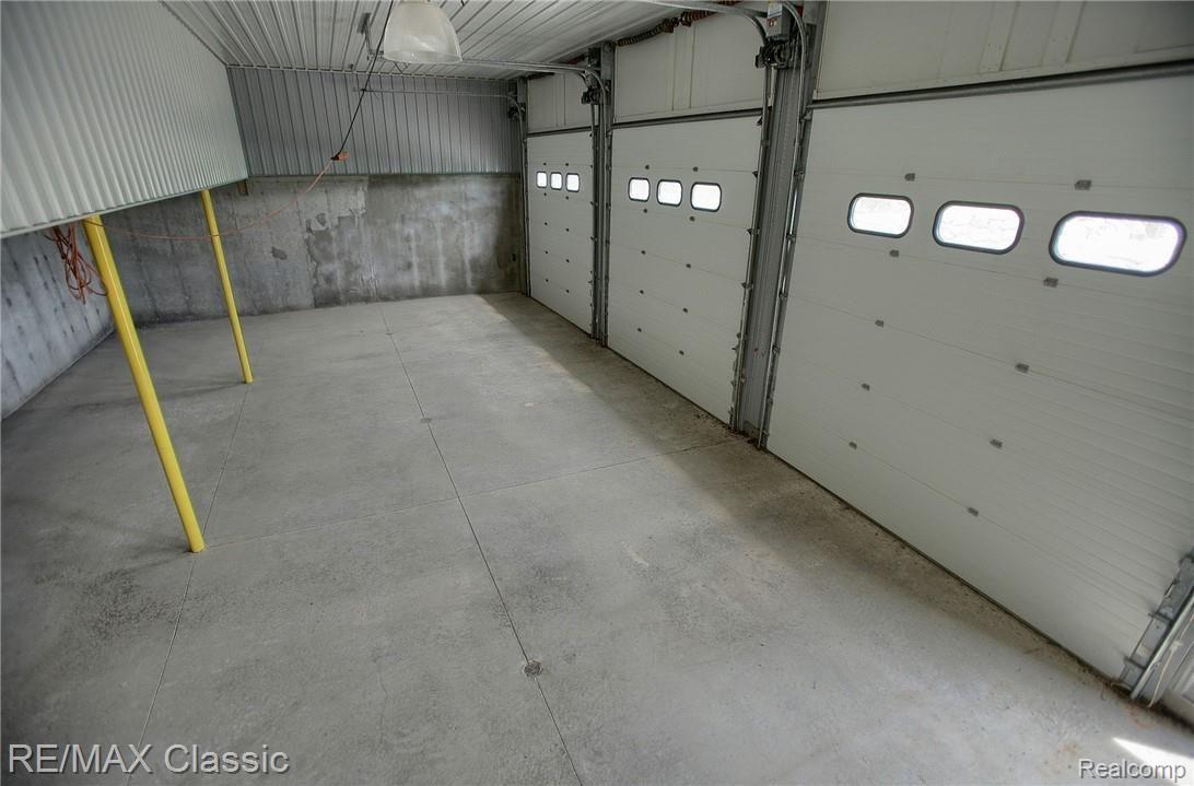8661 Antcliff Road Howell, MI 48855 - Photo 27 of 38 5_Car_Garage_Interior.jpg