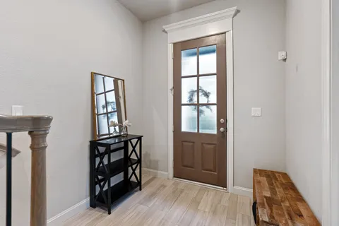 an empty room with windows and closet