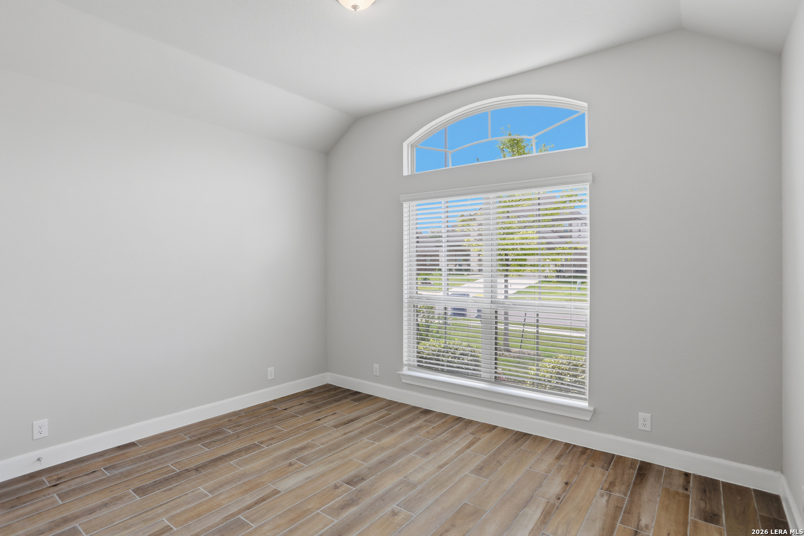 337 Misty Sails Cibolo, TX 78108 - Photo 29 of 50 a view of an empty room with wooden floor and a window