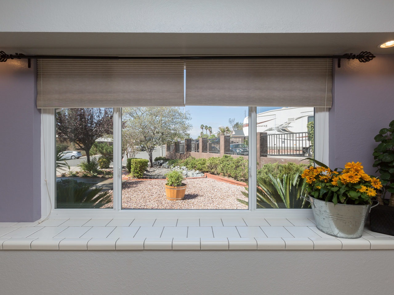 761 Hollowglen Road Oceanside, CA 92057 - Photo 7 of 24 Window in living room looking out over private low maintenance front yard.