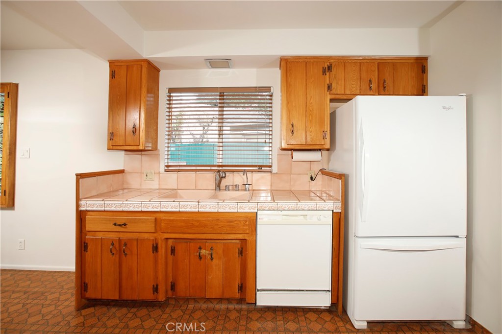 7861 Cora Street Sunland, CA 91040 - Photo 30 of 58 a utility room with dryer and washer