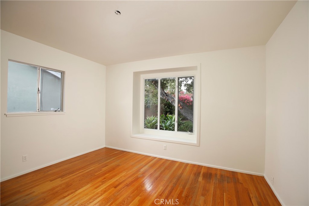 7861 Cora Street Sunland, CA 91040 - Photo 38 of 58 a view of an empty room with wooden floor and a window
