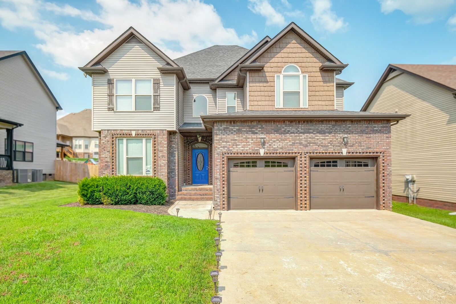 1487 Raven Road Clarksville, TN 37042 - Photo 1 of 44 a front view of a house with a yard and garage