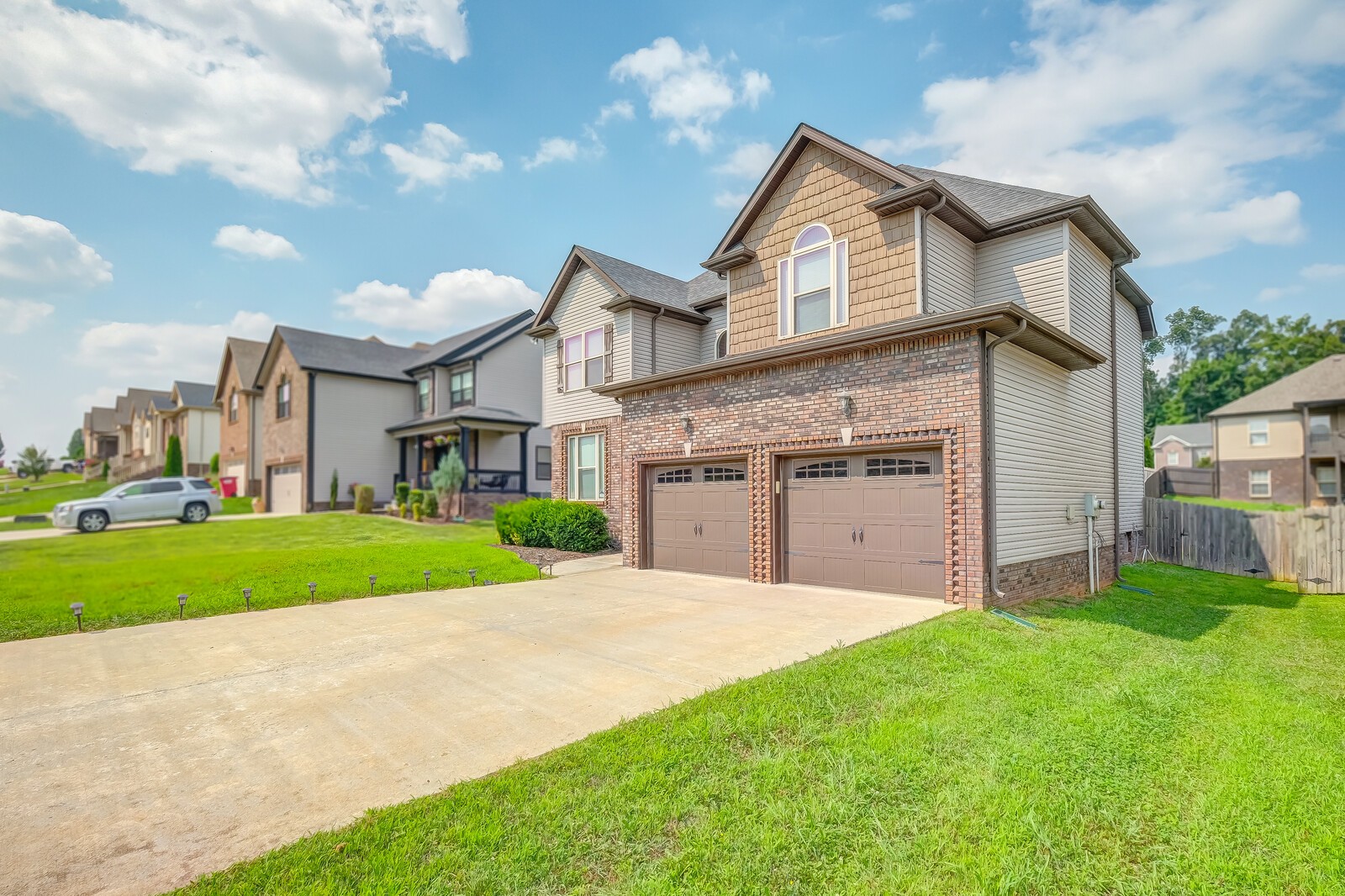 1487 Raven Road Clarksville, TN 37042 - Photo 2 of 44 a front view of a house with a yard and garage