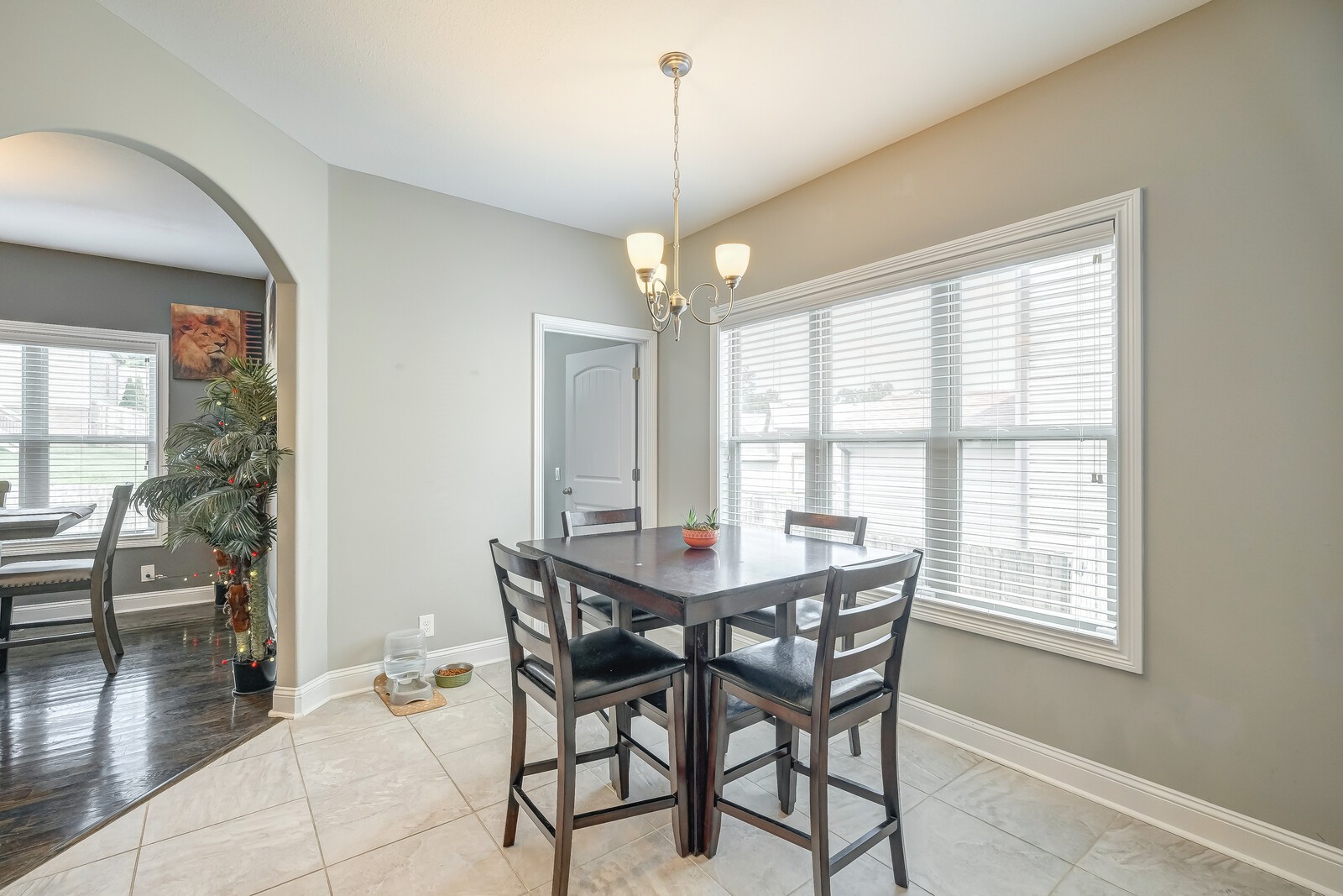1487 Raven Road Clarksville, TN 37042 - Photo 14 of 44 a dining room with furniture a chandelier and wooden floor