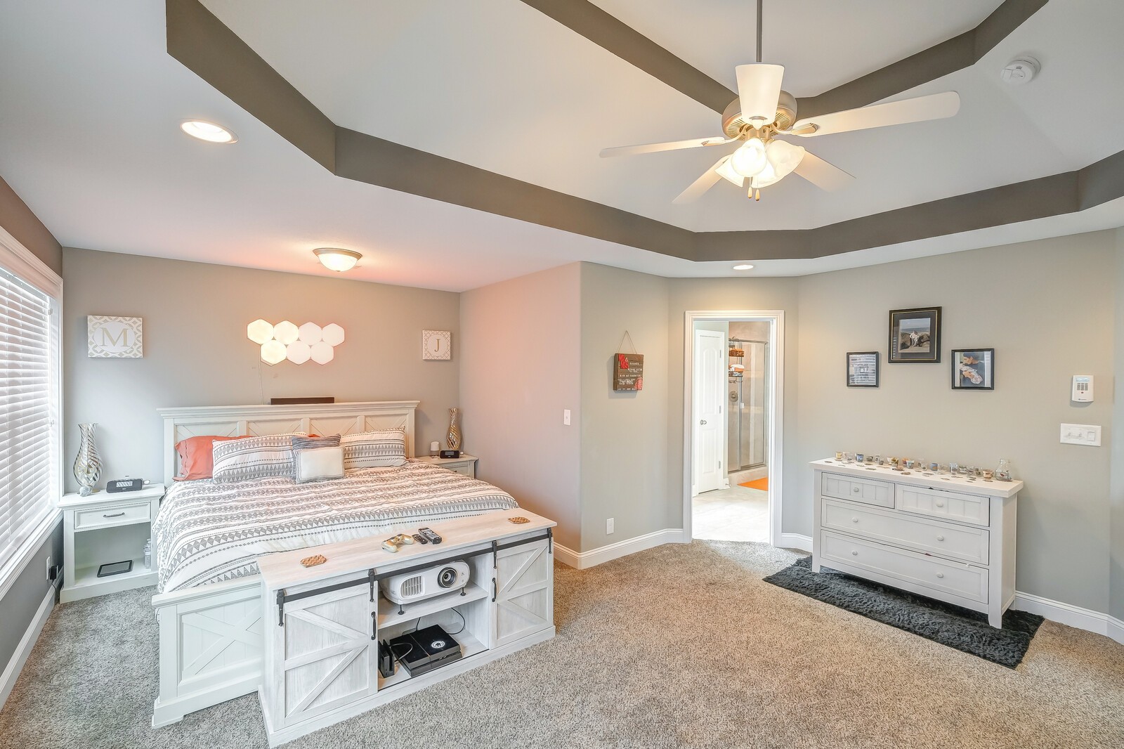 1487 Raven Road Clarksville, TN 37042 - Photo 27 of 44 a bedroom with a bed and a chandelier