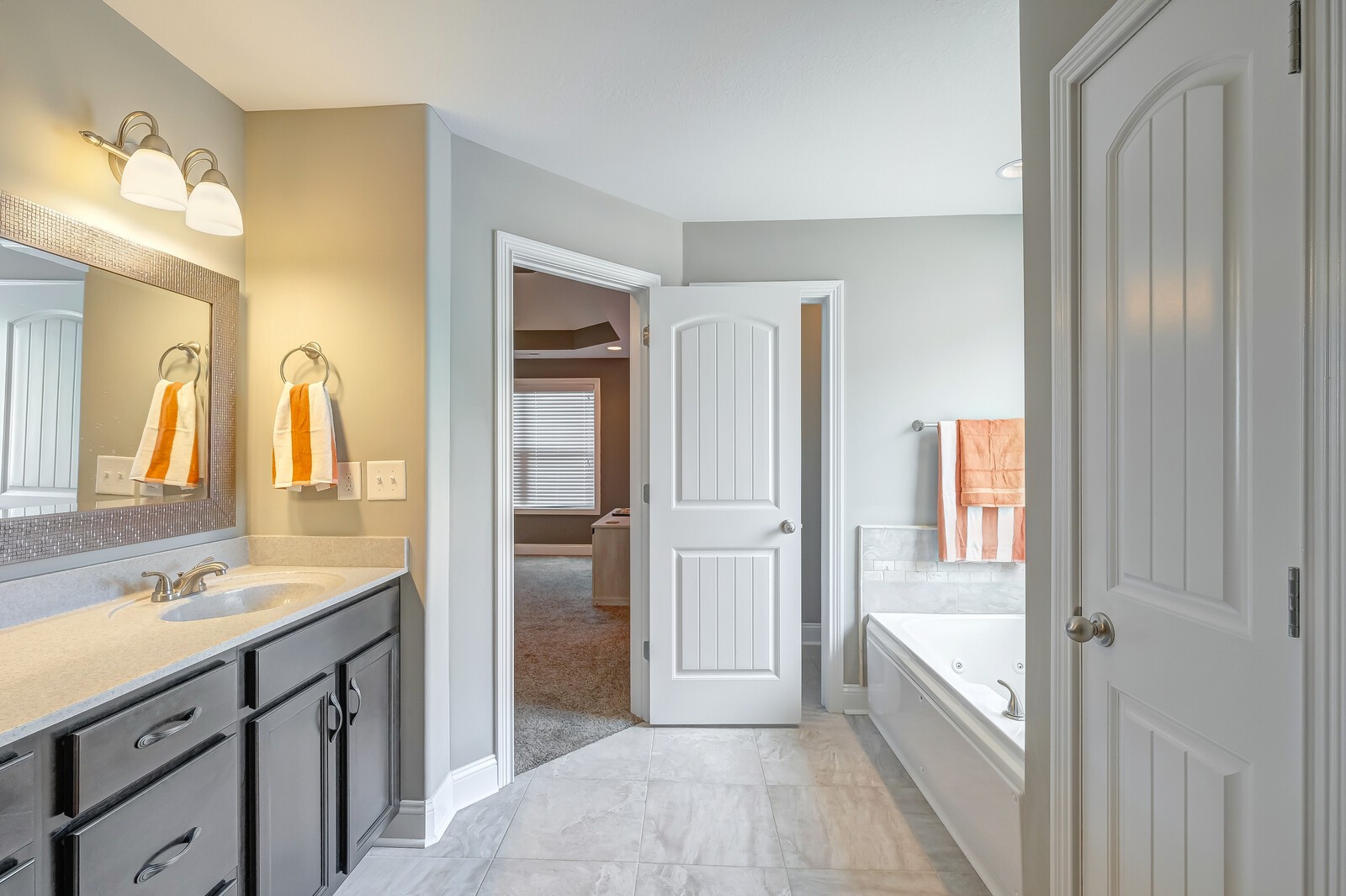 1487 Raven Road Clarksville, TN 37042 - Photo 33 of 44 a spacious bathroom with a granite countertop sink mirror and bathtub