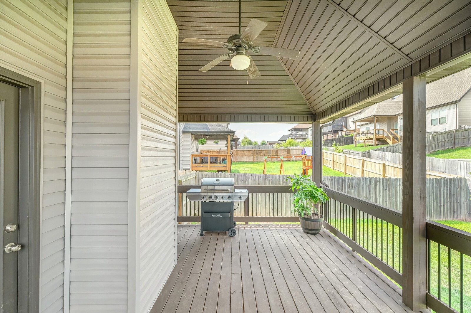 1487 Raven Road Clarksville, TN 37042 - Photo 40 of 44 a view of a balcony with furniture and wooden floor