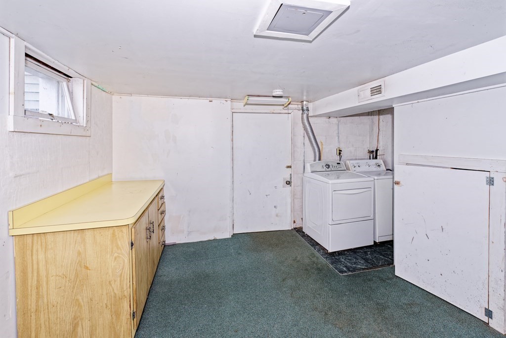 22 Union Avenue Wareham, MA 02571 - Photo 16 of 27 a utility room with cabinets washer and dryer