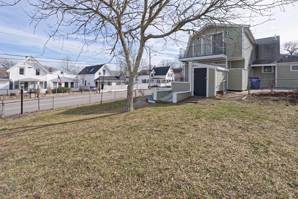22 Union Avenue Wareham, MA 02571 - Photo 19 of 27 a view of a yard with a house and a tree