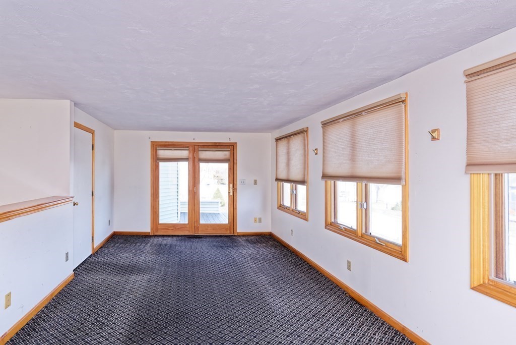 22 Union Avenue Wareham, MA 02571 - Photo 5 of 27 a view of an empty room with a window and wooden floor