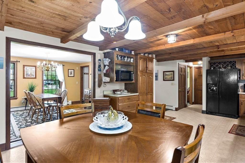 41 Baker Road Salisbury, MA 01952 - Photo 11 of 29 a room with stainless steel appliances wooden table and chairs