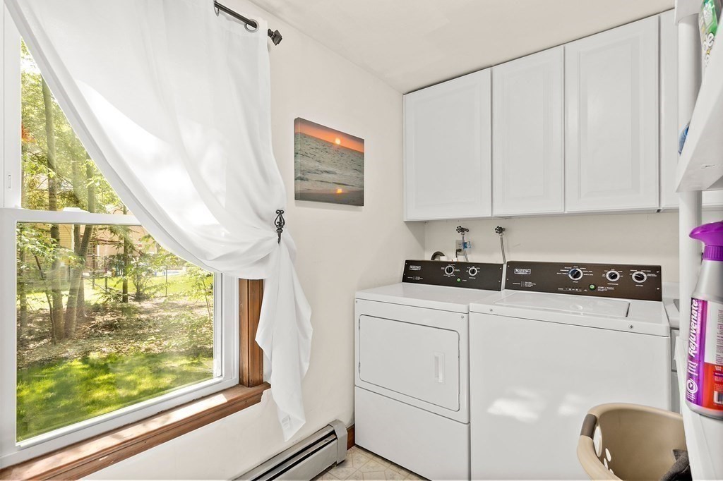 41 Baker Road Salisbury, MA 01952 - Photo 16 of 29 a kitchen with a sink a stove and white cabinets
