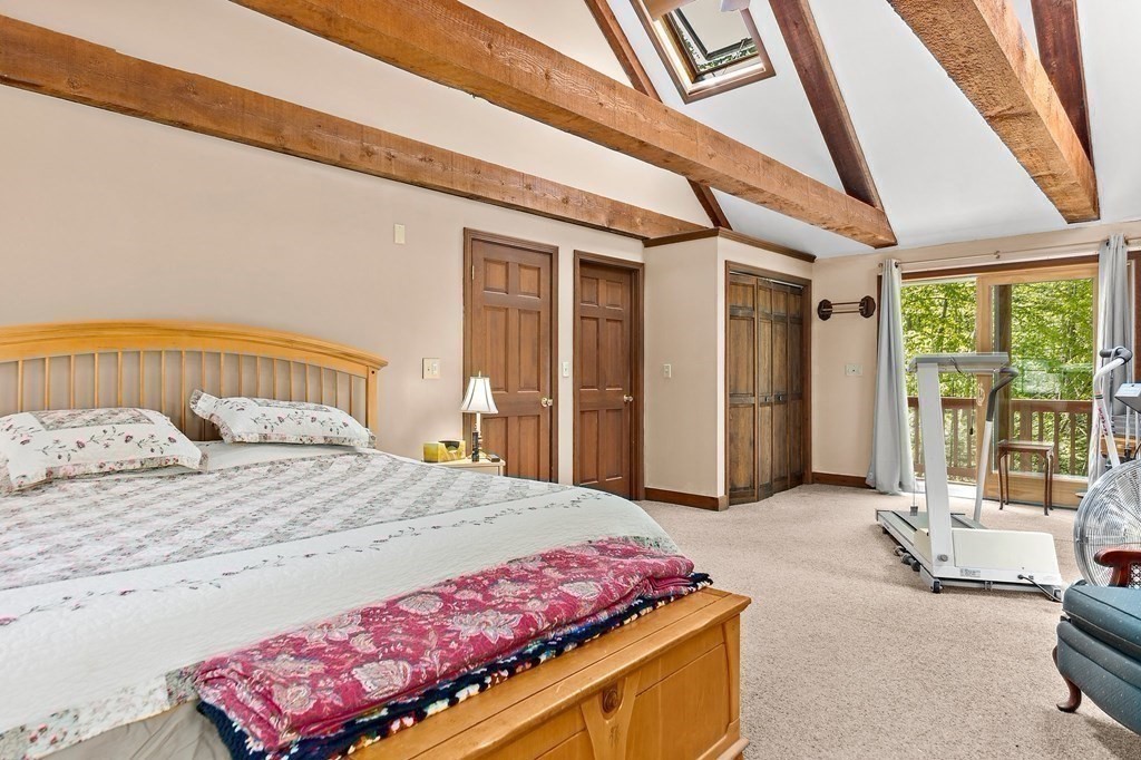 41 Baker Road Salisbury, MA 01952 - Photo 19 of 29 a bedroom with a bed and glass door