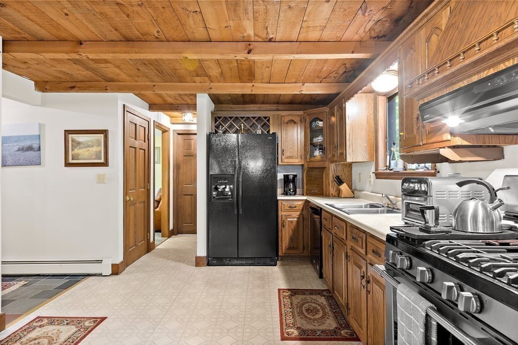 41 Baker Road Salisbury, MA 01952 - Photo 7 of 29 a kitchen with stainless steel appliances granite countertop a stove a refrigerator and a sink