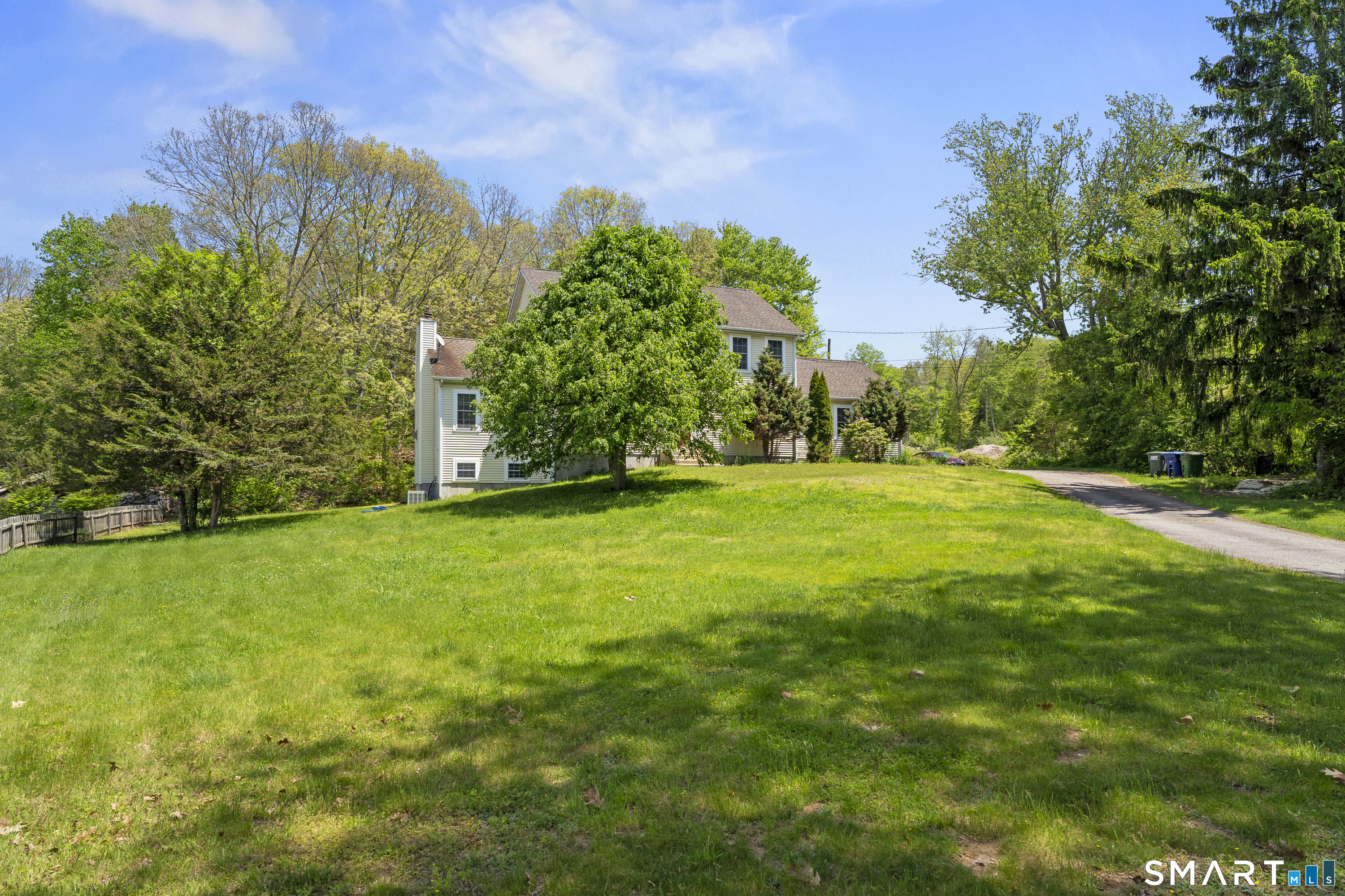 52 Middle Road Preston, CT 06365 - Photo 3 of 39 a view of a grassy field with trees in the background