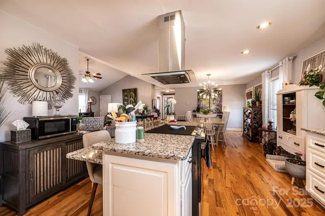 a kitchen with lots of counter top space and furniture