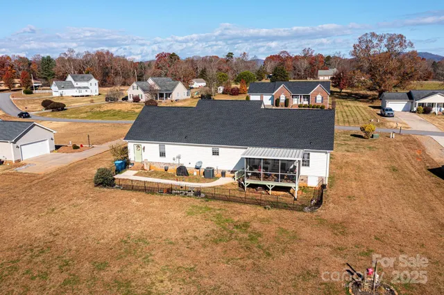an aerial view of a house with a garden