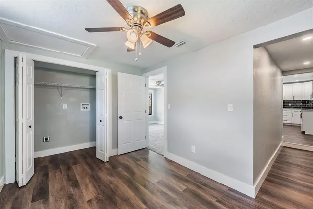 wooden floor in an empty room with a gallery