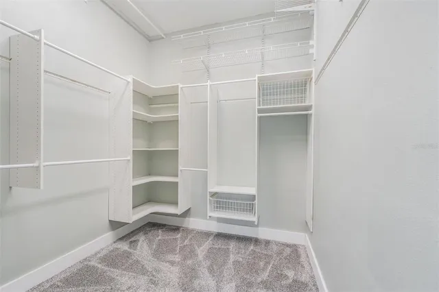 a view of an empty walk in closet