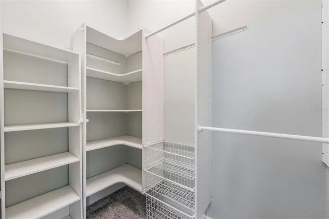 a view of an empty walk in closet