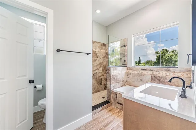 a bathroom with a sink and a large mirror