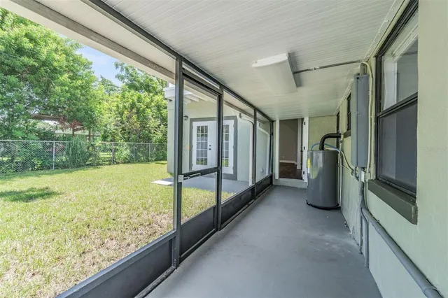 a view of a porch with wooden floor and outdoor space