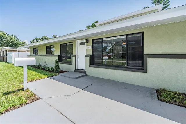 a view of a house with a garden