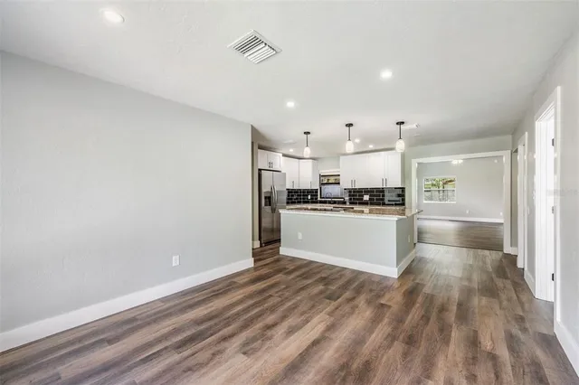 a view of kitchen with wooden floor