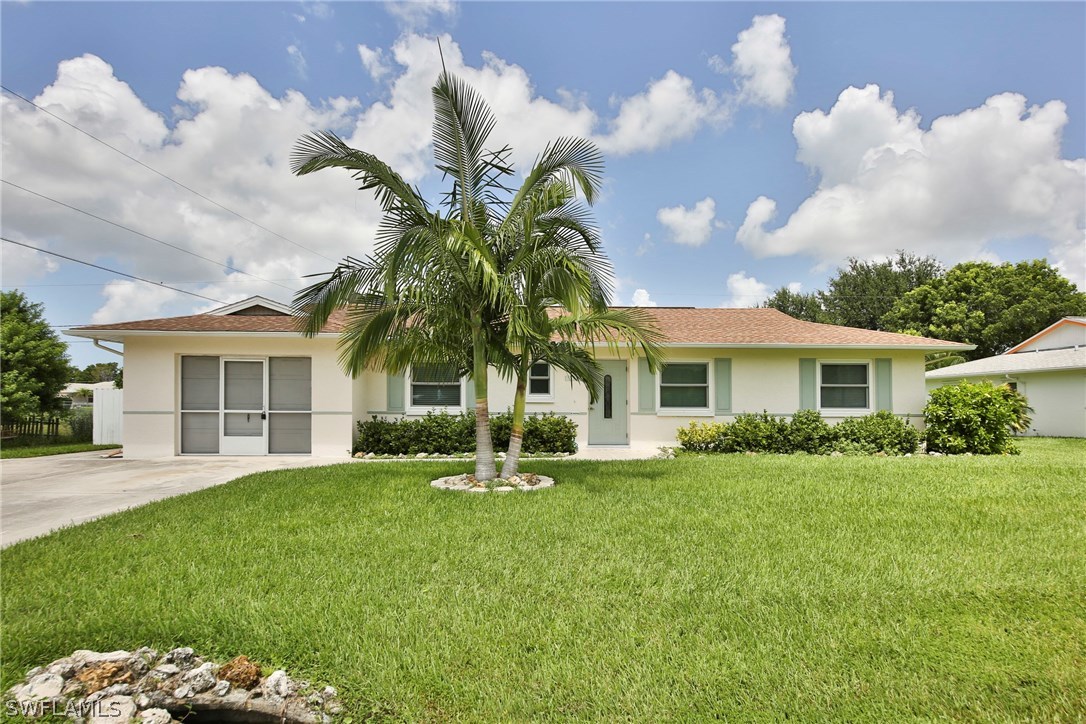 17520 Lebanon Road Fort Myers, FL 33967 - Photo 1 of 15 front view of a house with a yard